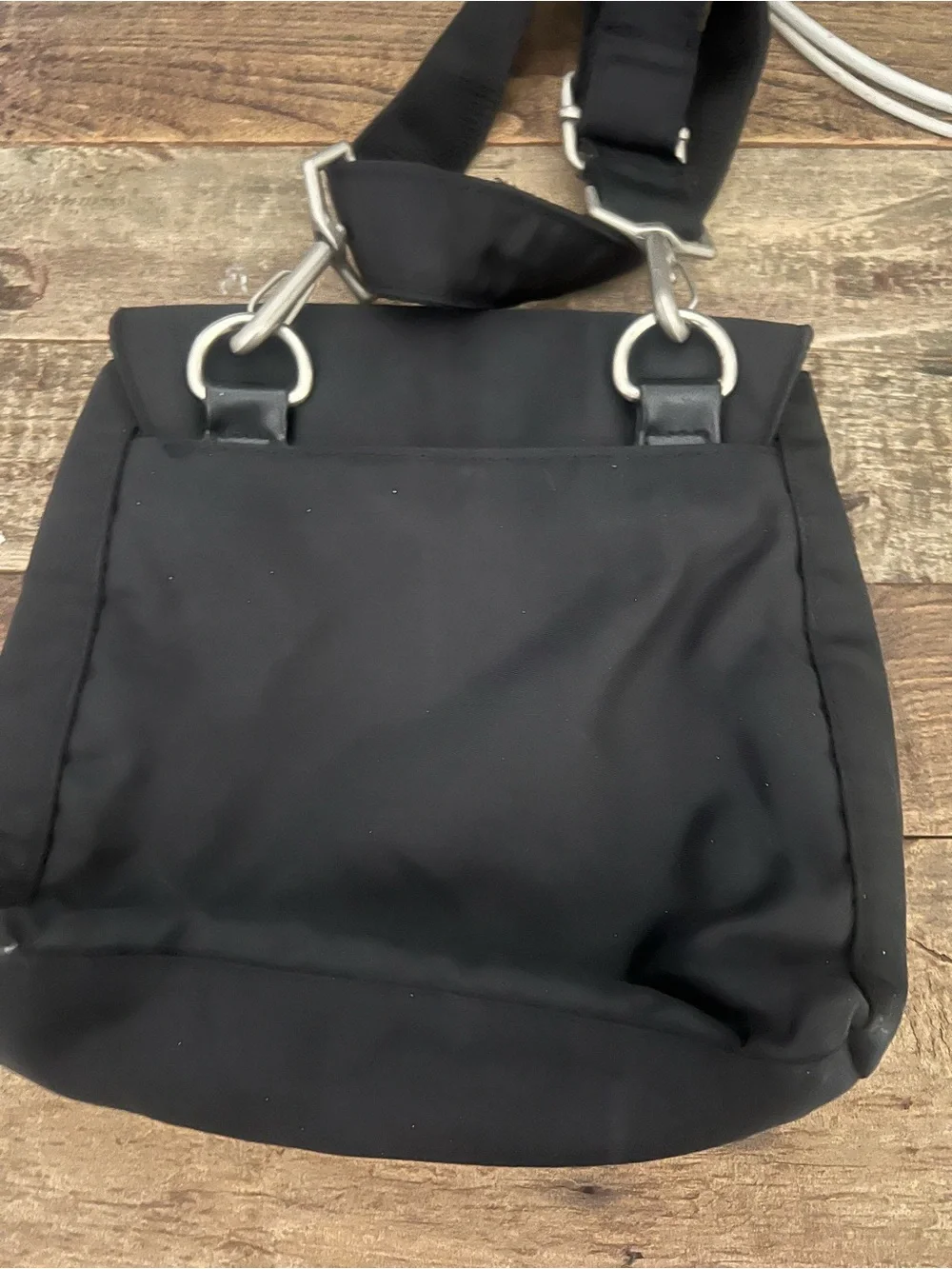 Black Crossbody Shoulder Bag with Winged Emblem by Nicole Miller